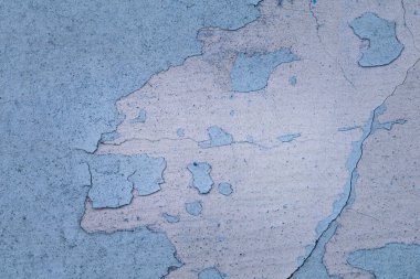 Eski bir binanın beton duvarının deseni. Tasarım için mavi boya yakın plan.