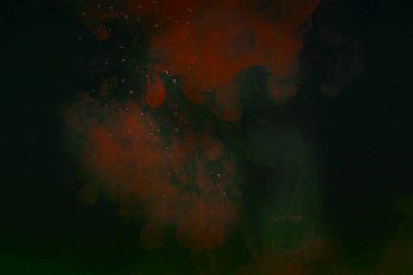 gizemli soyutlama kırmızı suluboya karanlık suda küçük kabarcıklar ile tasarım için fantastik arka plan