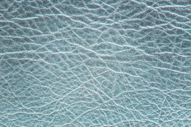 Dermantinow deri kaplamasının parlak dokusu tasarım için arka planda ışıklandırılmış desenler