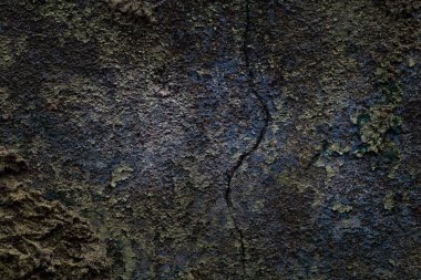 Çatlamış ve arkaplanı grunge olan beton bir duvarın muhteşem dokusu tasarım için