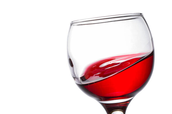 red wine like a sea wave in a beautiful glass of delicious alcoholic beverage made from grapes