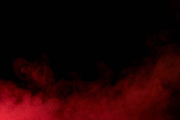 Beautiful red couple on a dark background bright and mysterious concept of smoking and addiction
