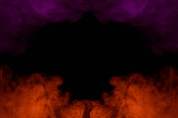 Violet and bright orange clouds of cigarette vapor on a dark background. abstraction for design. colored smoking concept