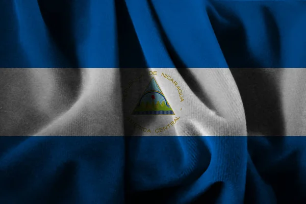 니카라과의 화려하고 아름다운 깃발로 직물을 배경으로 — 스톡 사진