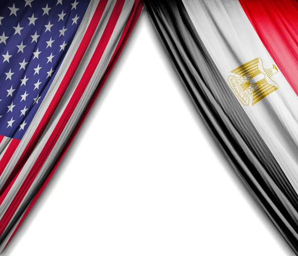 Flags of the United States of America and Egypt with theater effect. 3D Illustration
