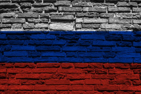 レンガの壁にロシアの旗 — ストック写真