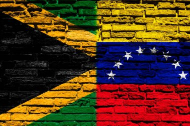 Jamaika ve Venezuela bayrakları tuğla duvarda