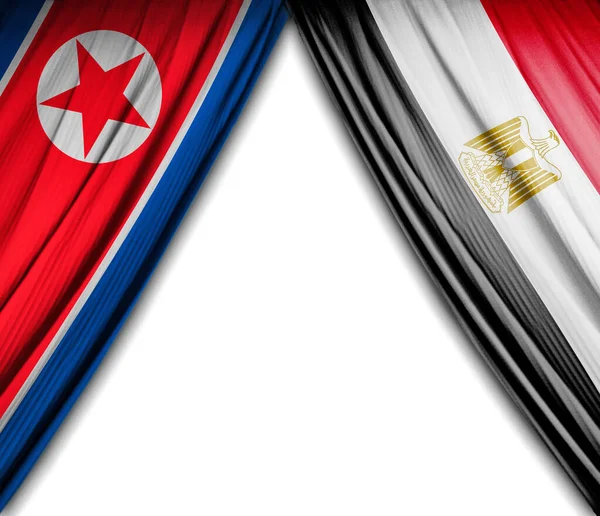 Flags of North Korea and Egypt with theater effect. 3D Illustration