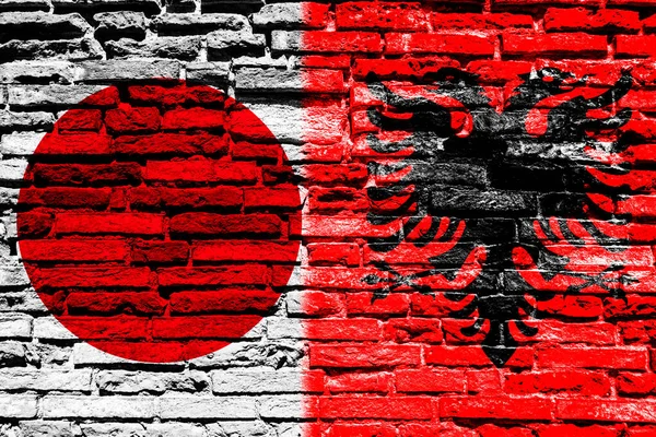 Vlaggen Van Japan Albanië Bakstenen Muur — Stockfoto