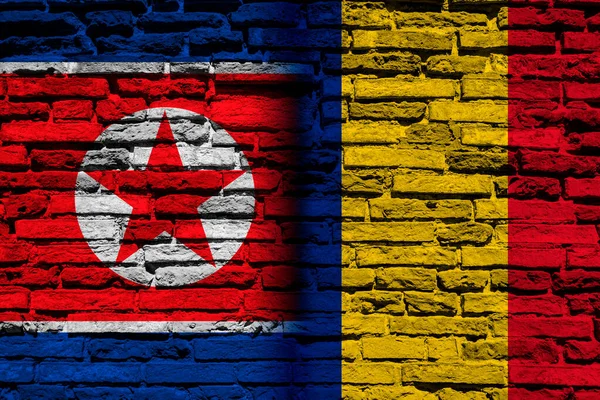 Flaggor Nordkorea Och Rumänien Tegelvägg — Stockfoto