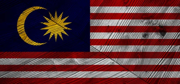 マレーシアの装飾的なカラフルな旗の木製の背景 — ストック写真