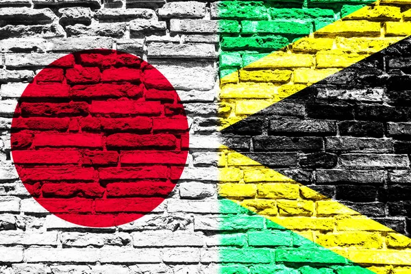 Japonya Jamaika Bayrakları Tuğla Duvarda — Stok fotoğraf