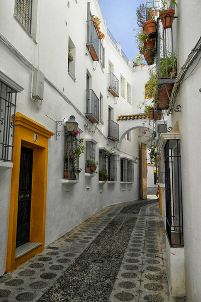 Narrow street of Cordoba. August 13, 2016 Cordoba, Andalusia - Spain