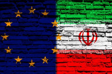 Tuğla duvarda Avrupa Birliği ve İran bayrakları