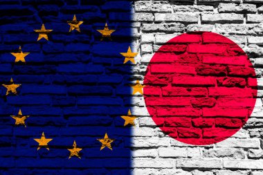 Avrupa Birliği ve Japonya 'nın bayrakları tuğla duvarda