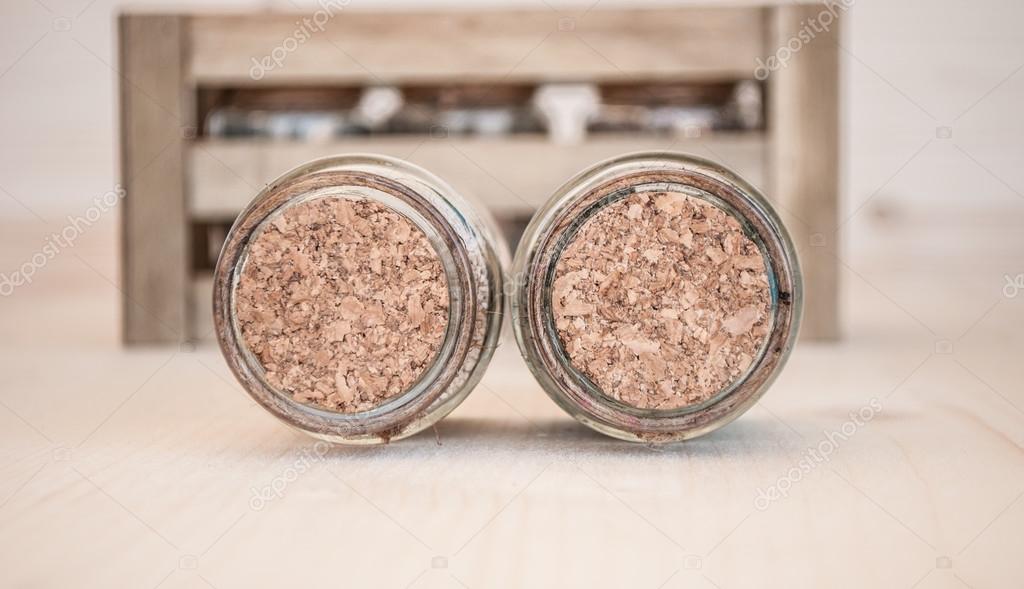small glass jars with sand and stones from the beach — Stock Photo © mahi_m 75035749