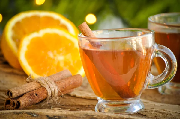 Hot wine for winter and Christmas with delicious orange and spices — Stock Photo, Image