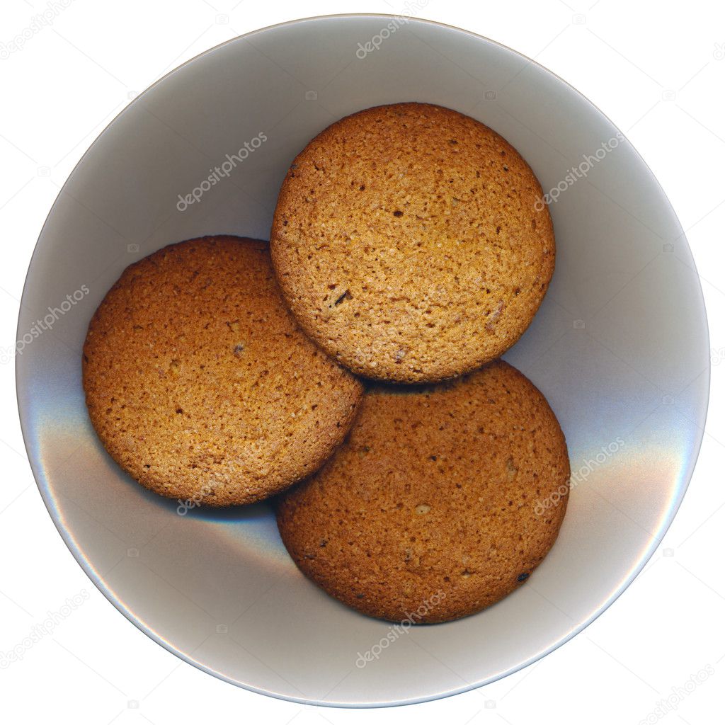Three cookies on the plate, isolated on white background