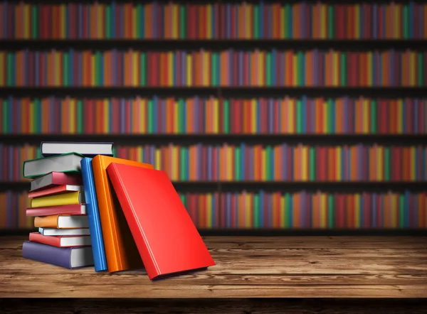 Wooden table with a stack of colored books. Blurred background from book shelves. Table top with books in the library. Back to school. Background design element, banner, poster