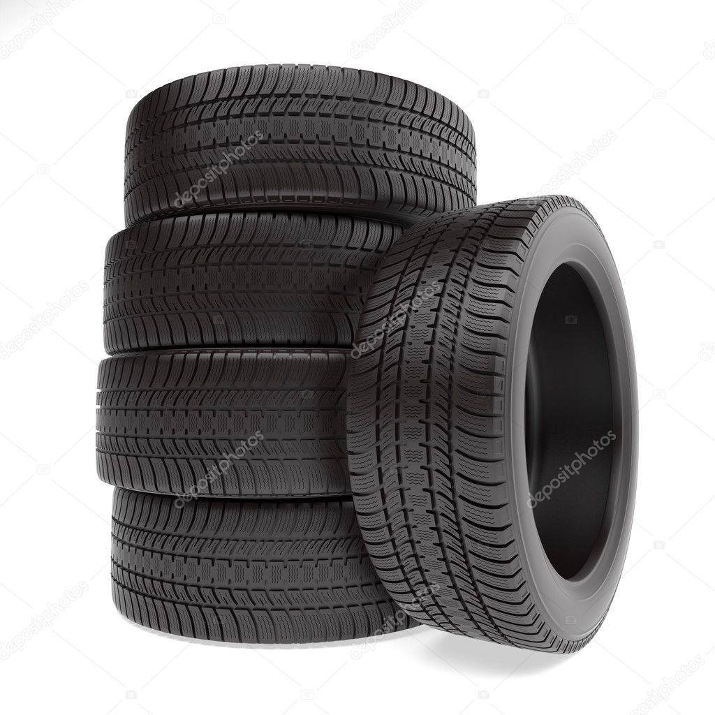 New tires stacked up and isolated on white background