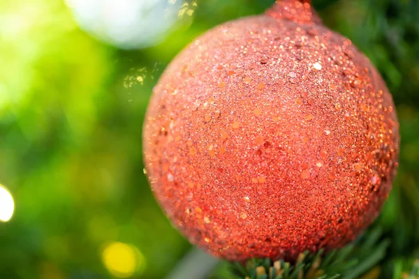 Close-up of a Christmas tree decorated. Holiday Christmas and new year wallpaper.
