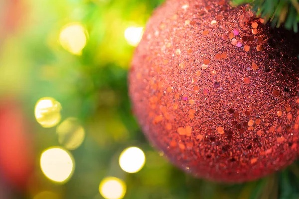 Close-up of a Christmas tree decorated. Holiday Christmas and new year wallpaper.