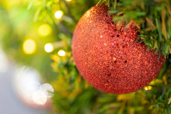 Close-up of a Christmas tree decorated. Holiday Christmas and new year wallpaper.