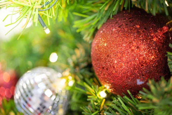 Close-up of a Christmas tree decorated. Holiday Christmas and new year wallpaper.