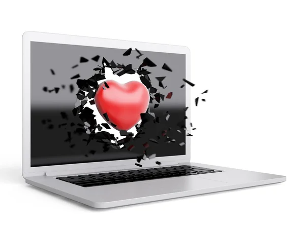 Červené srdce zničit notebook — Stock fotografie