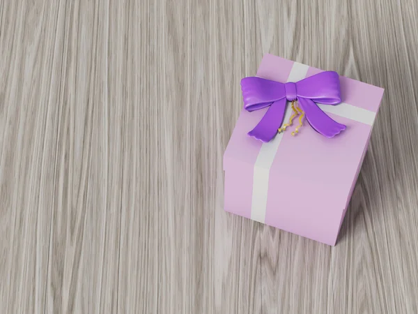 Розовая подарочная коробка с фиолетовым бантом — стоковое фото