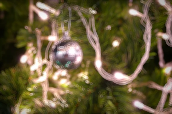 Gold Christmas background of de-focused lights with decorated tr — Stock Photo, Image