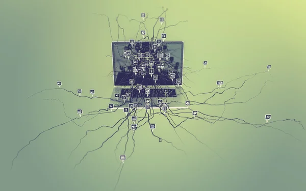 Iconos de redes sociales establecidos en la raíz que crece fuera de la computadora portátil . — Foto de Stock