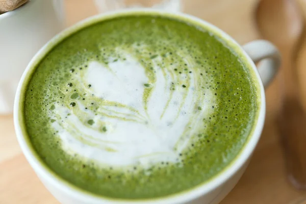 Hot green tea set on a wooden table in a coffeshop — Stock Photo, Image