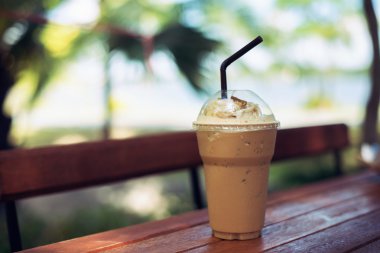 Coffe cold on wooden table brown  background