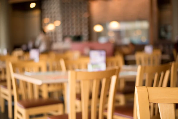 blur Background A beautiful wooden tables in restaurant.
