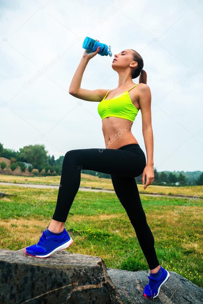 A sport girl drink water Stock Photo by ©Profstock 80727508