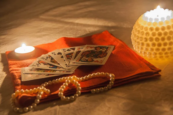 Candles, cards and pearl — Stock Photo, Image