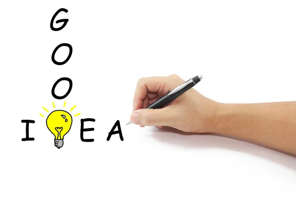 Hand with pen drawing big yellow light bulb with Good idea word — Stock Photo, Image