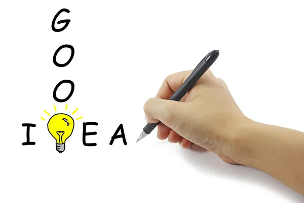 Hand with pen drawing big yellow light bulb with Good idea word — Stock Photo, Image
