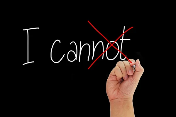 olumlu düşünme ve siyah arka plan üzerine izole motivasyon vermek cant yazma kalemi ile el.