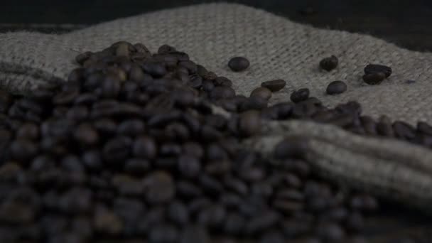 Coffee Beans Fall Wooden Surface Slow Motion — Stock Video