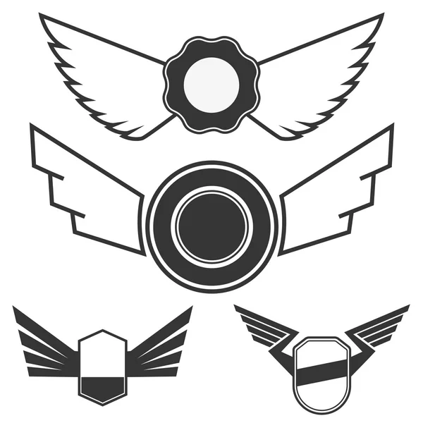 Emblemas con alas — Vector de stock