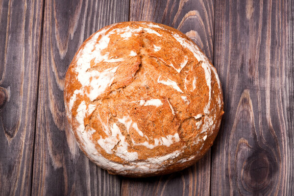 bread floured placed on a wooden background