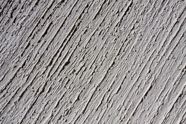 Grey wall with decorative plaster as a background — Stock Photo, Image