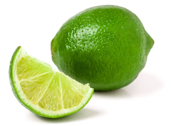 Lime with slices isolated on white background — Stock Photo, Image