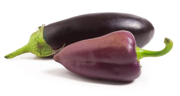 Eggplant and purple bell peppers isolated on white background — Stock Photo, Image