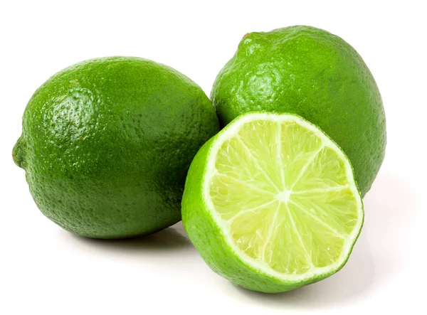 Two limes with half isolated on white background — Stock Photo, Image