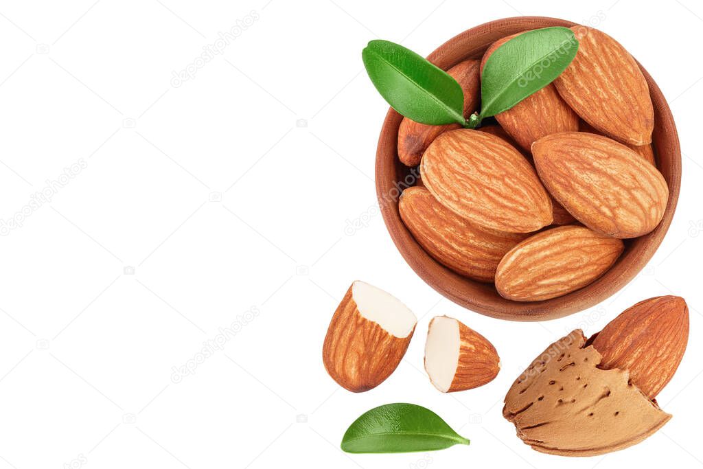 Almonds nuts in wooden bowl isolated on white background . Top view with copy space for your text. Flat lay