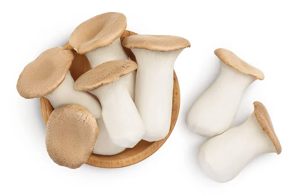 King Oyster mushroom or Eringi in wooden bowl isolated on white background with clipping path. Top view. Flat lay — Stock Photo, Image