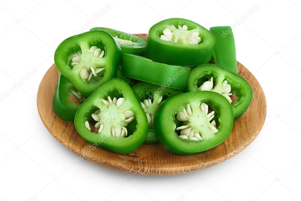 sliced jalapeno pepper in wooden bowl isolated on white background. Green chili pepper with clipping path and full depth of field.